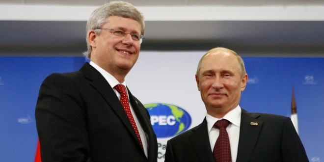 Foto: Premierul canadian Stephen Harper (stânga)