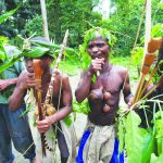 Ugandan pygmies perform a traditional dance after an unsucessful monkey hunt in Bundibugyo